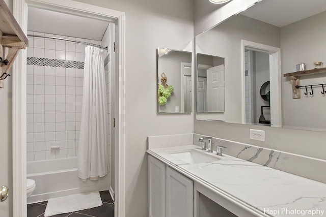 full bathroom featuring tile patterned floors, vanity, shower / tub combo, and toilet