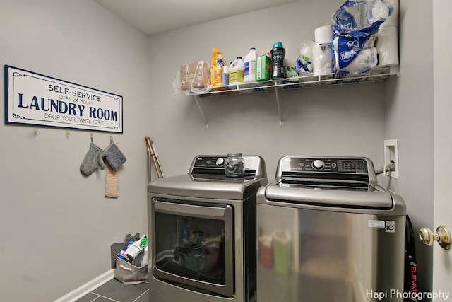 laundry area featuring independent washer and dryer and tile patterned floors