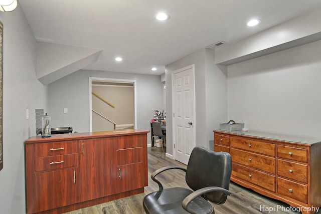 office space with dark wood-type flooring