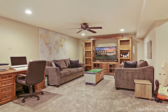 carpeted living room featuring ceiling fan