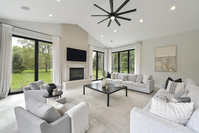 living room featuring vaulted ceiling and ceiling fan