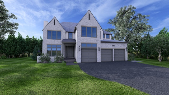 view of front of home with a garage and a front lawn