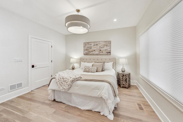 bedroom with light wood-type flooring