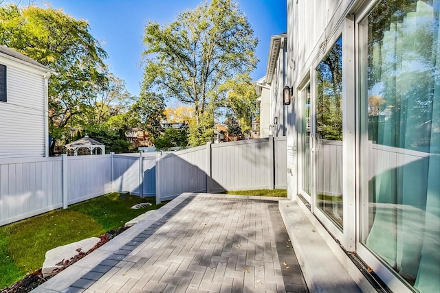 wooden terrace with a patio