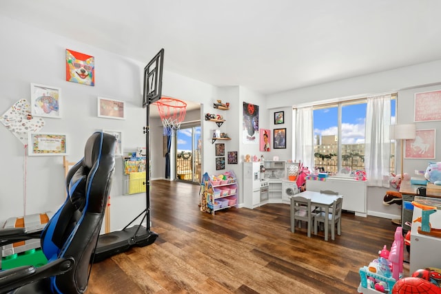 game room featuring dark hardwood / wood-style floors