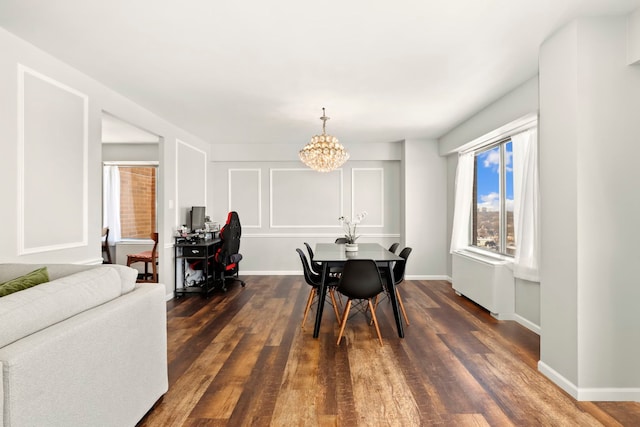 dining area with an inviting chandelier and dark hardwood / wood-style flooring