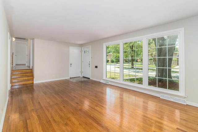 unfurnished living room with light wood-type flooring