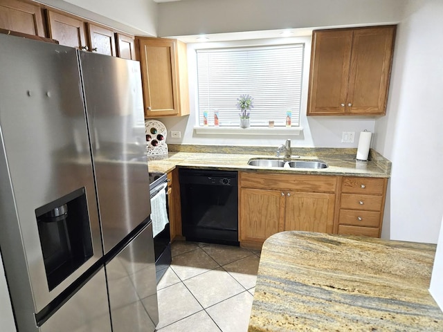 kitchen featuring sink, light tile patterned floors, and stainless steel appliances