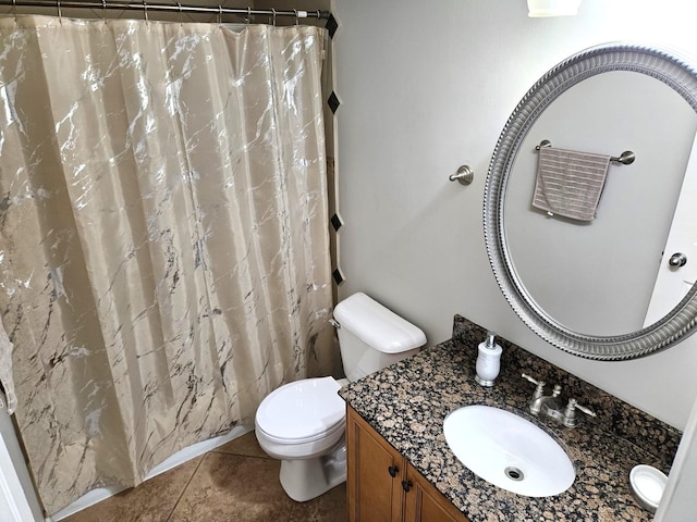 bathroom featuring tile patterned floors, walk in shower, vanity, and toilet