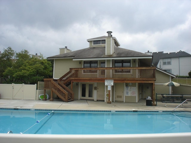 view of swimming pool with a wooden deck