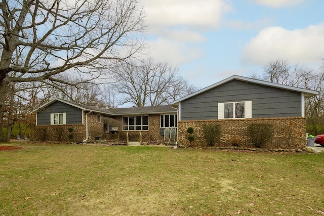 back of house with a lawn