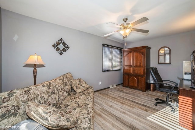 office featuring ceiling fan and light hardwood / wood-style floors