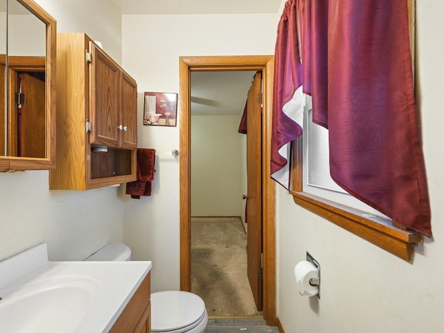 bathroom featuring vanity and toilet