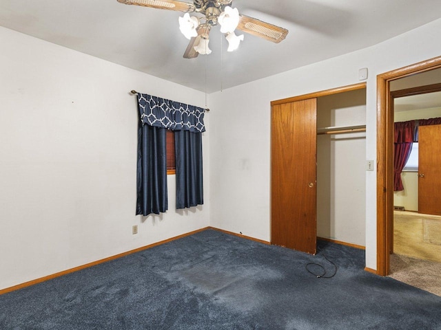 unfurnished bedroom featuring ceiling fan, a closet, and carpet floors