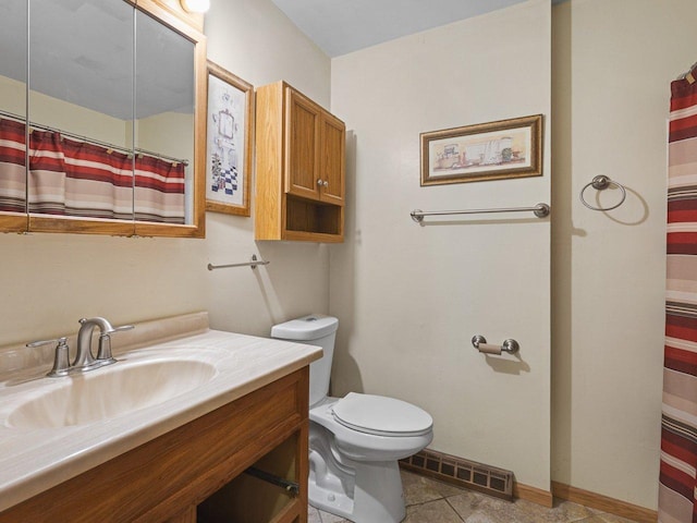 bathroom with tile patterned floors, vanity, toilet, and a shower with curtain