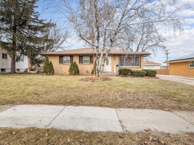 single story home featuring a front lawn