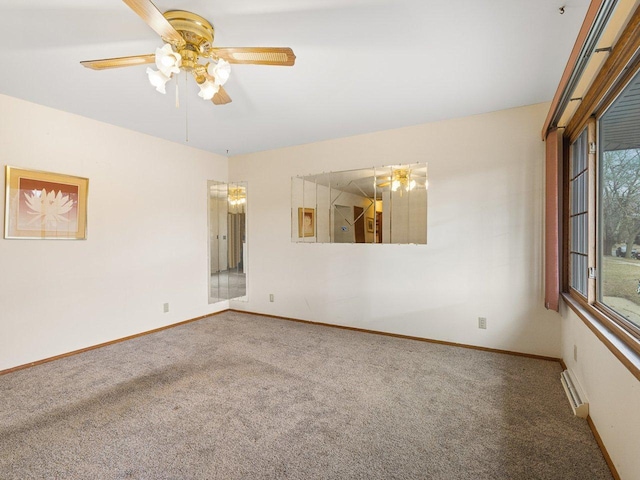 carpeted empty room featuring ceiling fan