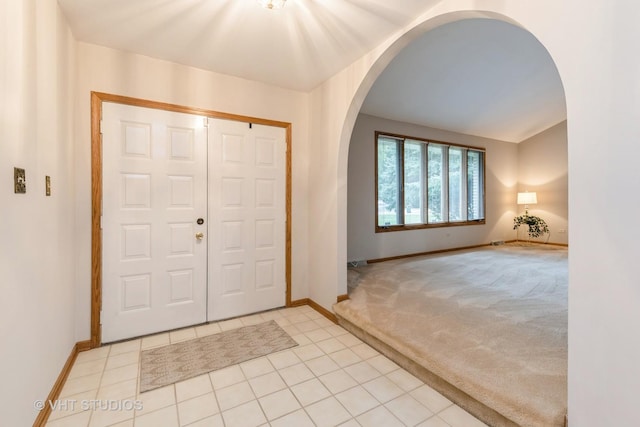 entryway with light tile patterned floors