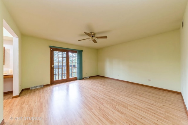 spare room with light hardwood / wood-style floors and ceiling fan