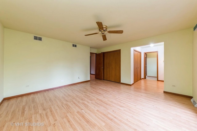 unfurnished room with light hardwood / wood-style flooring and ceiling fan