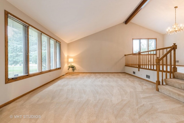 living room featuring lofted ceiling with beams, light carpet, a healthy amount of sunlight, and a notable chandelier