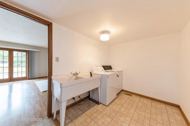 washroom featuring independent washer and dryer