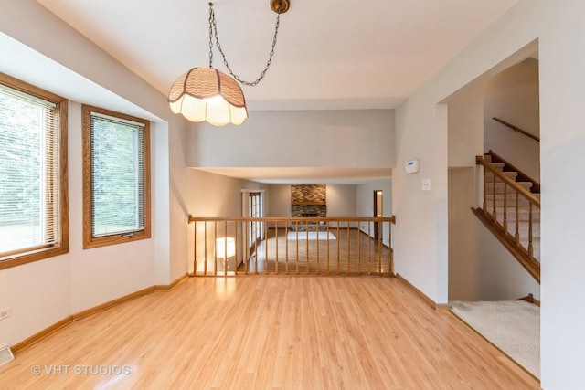 empty room featuring hardwood / wood-style flooring and a fireplace