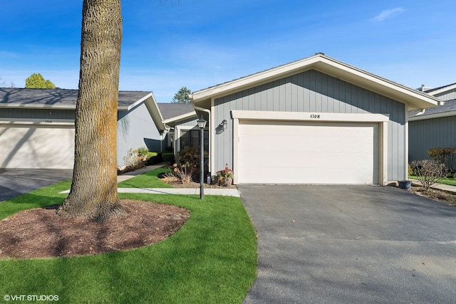 ranch-style house featuring a garage