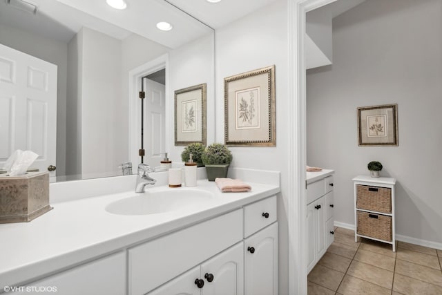 bathroom featuring tile patterned flooring and vanity