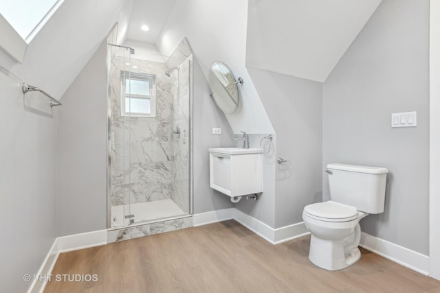 bathroom featuring hardwood / wood-style flooring, an enclosed shower, vanity, vaulted ceiling, and toilet