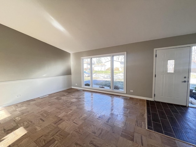 entrance foyer with vaulted ceiling