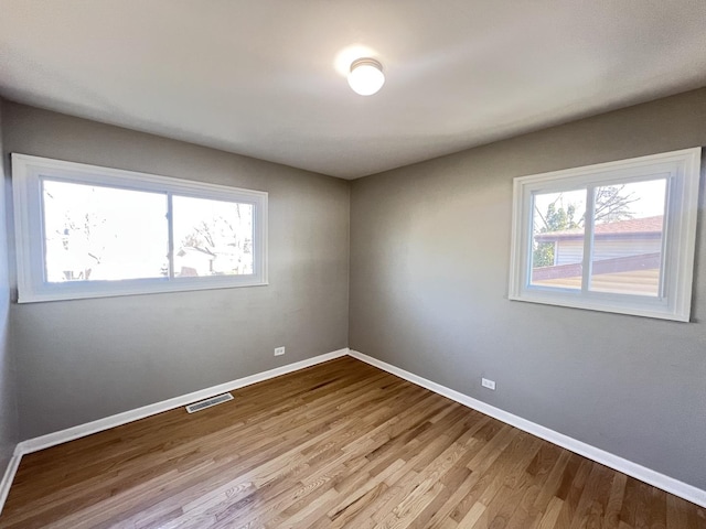 spare room featuring light wood-type flooring