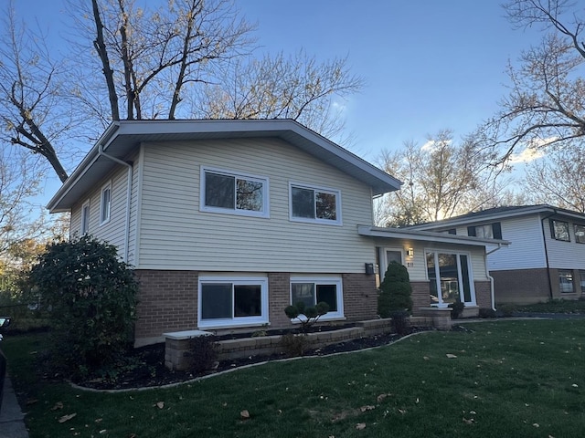 split level home featuring a front lawn