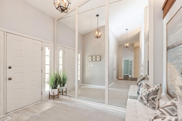 foyer with high vaulted ceiling