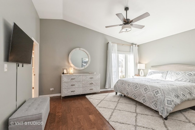 bedroom with vaulted ceiling, dark hardwood / wood-style floors, and ceiling fan