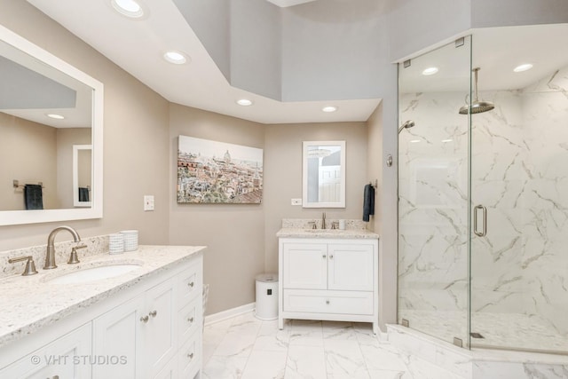 bathroom featuring vanity and an enclosed shower