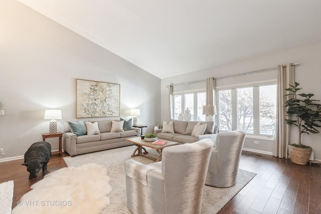 living room featuring hardwood / wood-style flooring and lofted ceiling