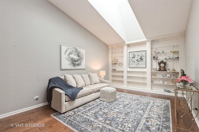 living room featuring vaulted ceiling, dark wood-type flooring, and built in features