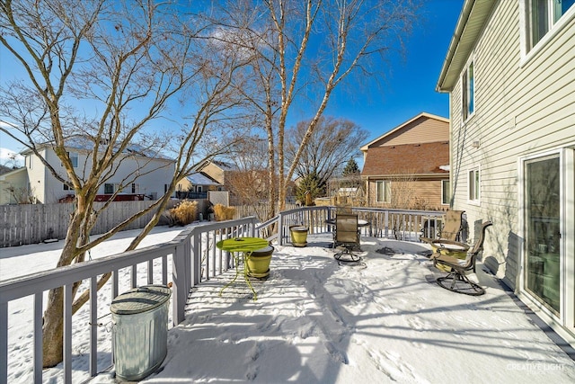 view of snow covered deck