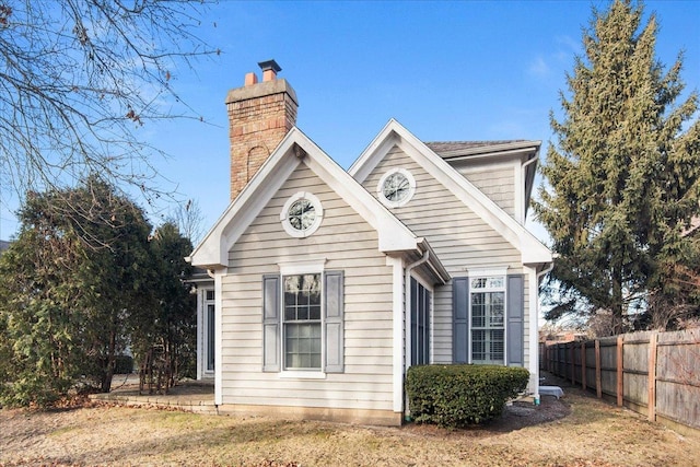 view of side of home with a lawn