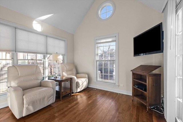 sitting room featuring lofted ceiling and dark wood-type flooring