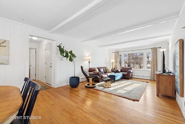 living room with beam ceiling, light wood-type flooring, and baseboard heating