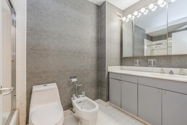 bathroom with vanity, a shower with door, a bidet, tile patterned flooring, and toilet