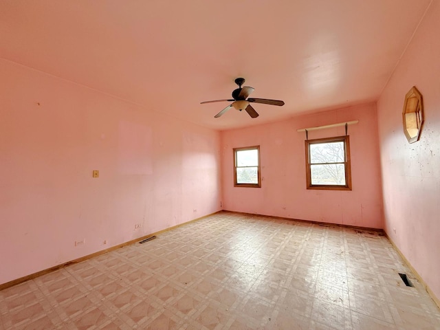 spare room with ceiling fan