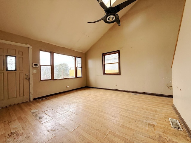 foyer entrance with ceiling fan, high vaulted ceiling, and light hardwood / wood-style flooring