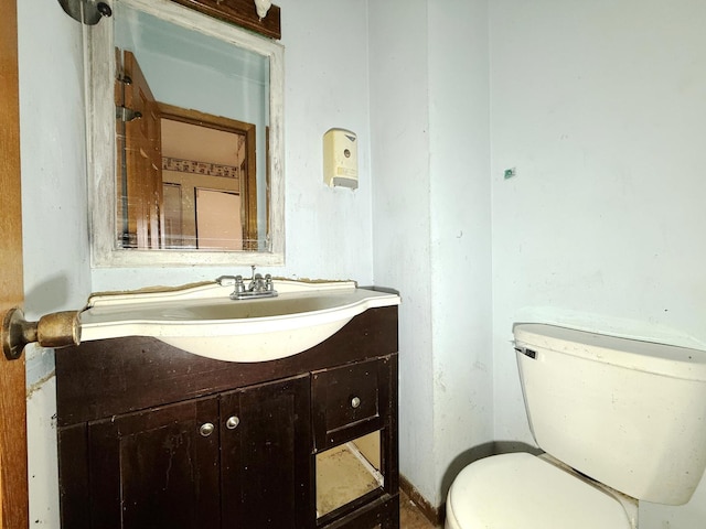 bathroom with toilet and vanity