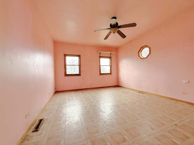 empty room featuring ceiling fan