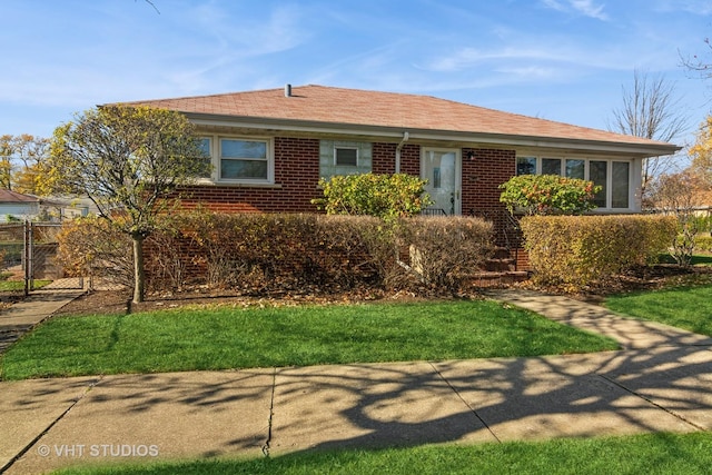 ranch-style home with a front yard