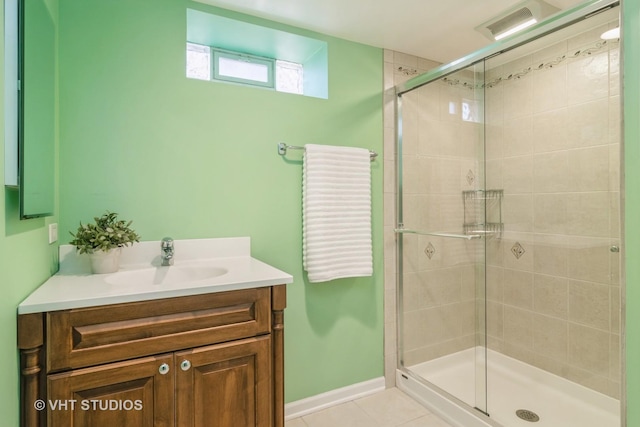 bathroom with vanity, tile patterned floors, and walk in shower