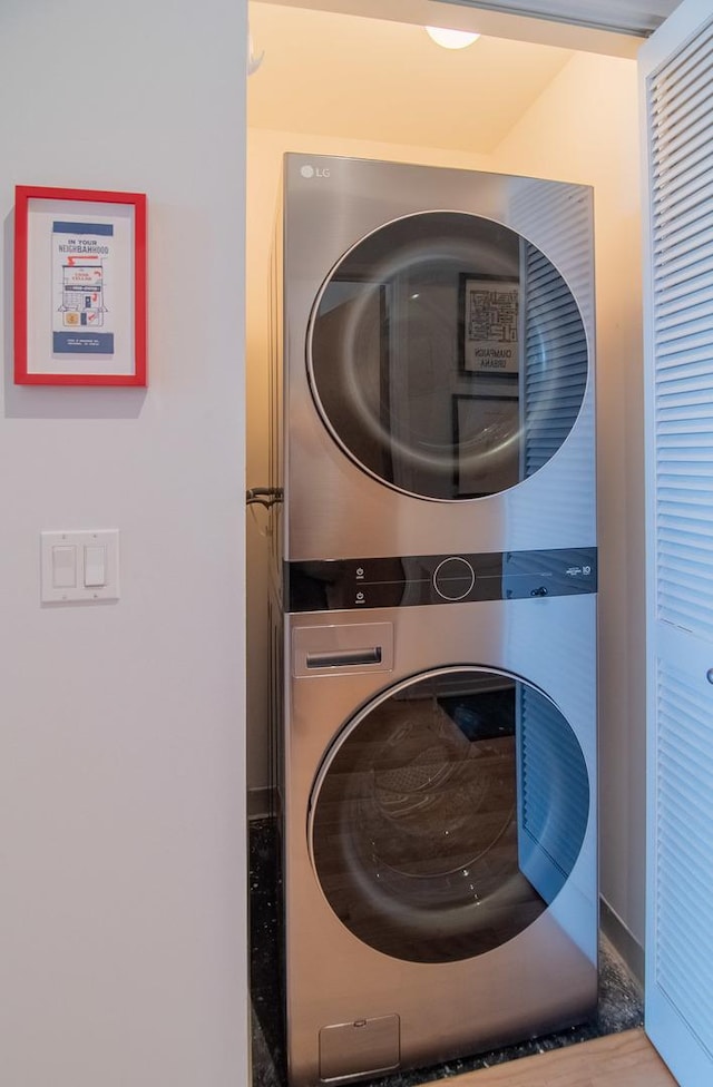 laundry room featuring stacked washer / dryer